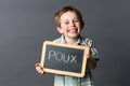 Laughing child advertising against French 'poux' or head lice Royalty Free Stock Photo