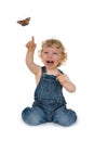 Laughing child reaching for a butterfly Royalty Free Stock Photo