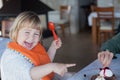 Laughing child sharing chocolate cake with mother Royalty Free Stock Photo