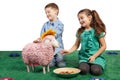 Laughing children playing with a toy sheep Royalty Free Stock Photo