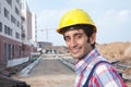 Laughing construction worker with black hair