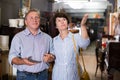 Laughing couple is shopping in the antique store Royalty Free Stock Photo