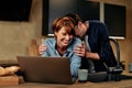 Laughing couple using a laptop at home Royalty Free Stock Photo