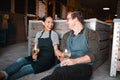 Laughing couple, wine tasting date and drinking alcohol with glasses in remote farm distillery, winery estate or Royalty Free Stock Photo