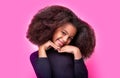 Laughing cute afro girl portrait. Cute multiracial small girl smiling, Isolated on a pink background. Smile little Royalty Free Stock Photo