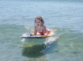 Laughing Cute Little Girl on Boogie Board in Summer Royalty Free Stock Photo