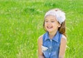 Laughing cute little girl on the meadow