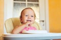 Laughing eating baby girl Royalty Free Stock Photo