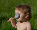 laughing eating baby girl with dirty face. Royalty Free Stock Photo