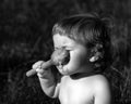 laughing eating baby girl with dirty face. Royalty Free Stock Photo