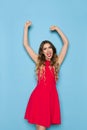 Laughing Elegant Woman With Arms Raised Royalty Free Stock Photo