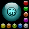 Laughing emoticon icons in color illuminated glass buttons