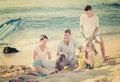 Laughing family playing together on beach Royalty Free Stock Photo