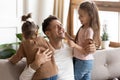 Laughing father spend funny pleasant time with two little daughters