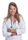 Laughing female doctor with crossed arms Royalty Free Stock Photo