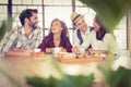 Laughing friends enjoying coffee and treats Royalty Free Stock Photo