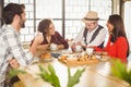 Laughing friends enjoying coffee and treats Royalty Free Stock Photo