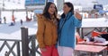 Laughing friends taking selfie at a ski resort Royalty Free Stock Photo