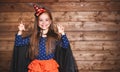 Funny child girl in witch costume in halloween Royalty Free Stock Photo