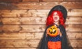 Funny child girl in witch costume in halloween Royalty Free Stock Photo