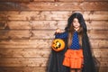 Funny child girl in witch costume in halloween Royalty Free Stock Photo