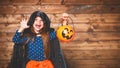 Funny child girl in witch costume in halloween Royalty Free Stock Photo