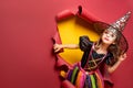 Laughing funny child girl in a witch costume in halloween Royalty Free Stock Photo