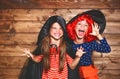 Funny children sister twins girl in witch costume in halloween Royalty Free Stock Photo