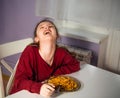 Laughing funny kid girl eating tasty spaghetti on the dinner on the home kitchen. Closeup Royalty Free Stock Photo