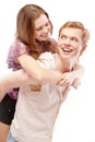 Laughing girl astride young man