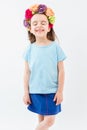 Laughing girl in blue tshirt and flowers national headdress.