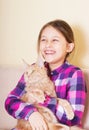 Laughing girl and cat Royalty Free Stock Photo