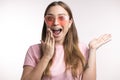 Laughing girl closing her mouth with a hand Royalty Free Stock Photo