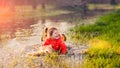 Laughing girl falling in puddle
