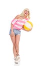 Laughing girl holding a beach ball Royalty Free Stock Photo