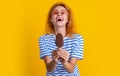 laughing girl with icelolly ice cream in studio. girl with icelolly ice cream on background.