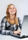 Laughing girl with laptop Royalty Free Stock Photo