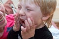 Laughing grandmother and screaming grandson, face portrait