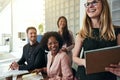 Laughing group of businesspeople working together in an office Royalty Free Stock Photo
