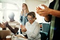 Laughing group of diverse colleagues clapping during an office m Royalty Free Stock Photo