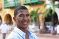 Laughing guy in a blue shirt in a colorful colonial town Royalty Free Stock Photo