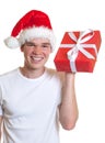 Laughing guy with christmas hat and gift