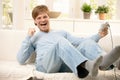 Laughing guy with computer game Royalty Free Stock Photo