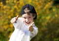 Laughing handsome boy posing both thumbs up