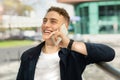 Laughing handsome young european guy enjoy good news, success business, calling