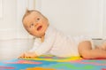 Laughing happy face of toddler baby boy on floor Royalty Free Stock Photo