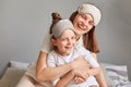 Laughing happy positive mother and her daughter child playing and hugging together laughing happily enjoying pastime on weekend, Royalty Free Stock Photo