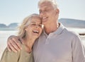 Laughing, happy and senior couple at the beach with love, freedom and care on vacation. Funny man and woman on Royalty Free Stock Photo