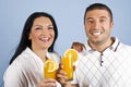 Laughing healthy couple with oranges juice Royalty Free Stock Photo