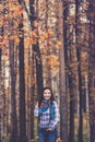 Laughing hipster cow-girl in autumn park